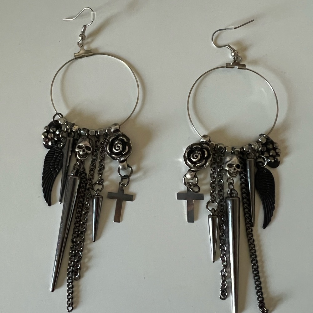 Earrings, dangling hoops.